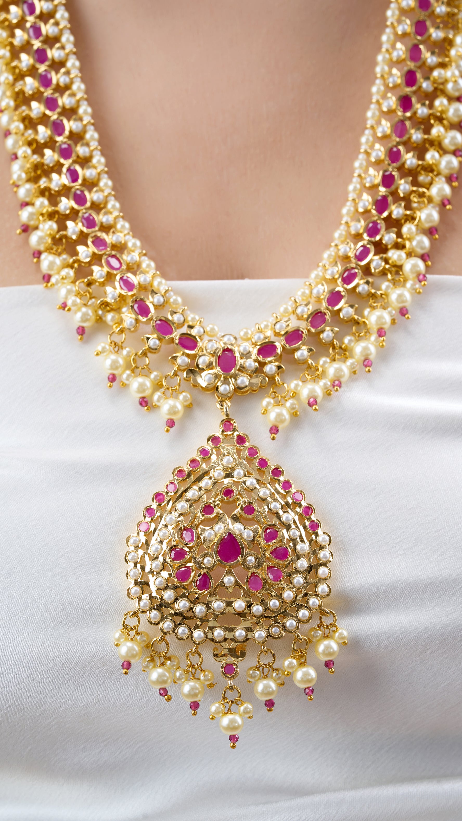 MADHAVI LONG JADAU GOLD FOIL NECKLACE SET WITH PURE PEARLS IN RED